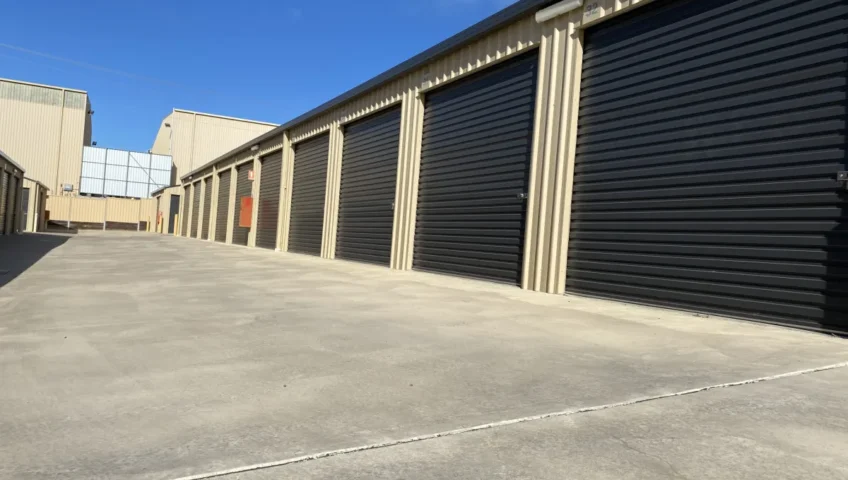 Row of storage units with black roller doors at Strathdale Self Storage in Bendigo